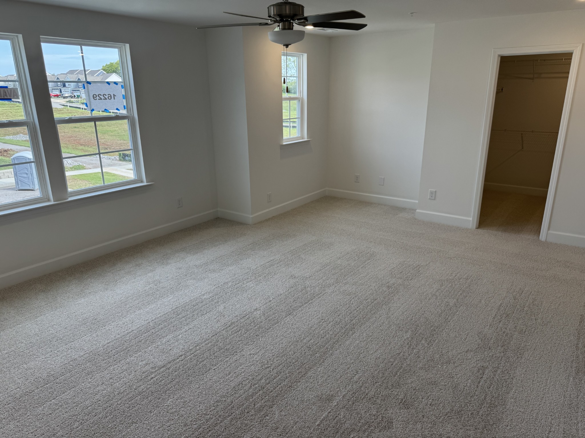 1110 June Wilde Ridge Spring Hill, TN 37174 - Photo 15 of 28 an empty room with windows and a ceiling fan