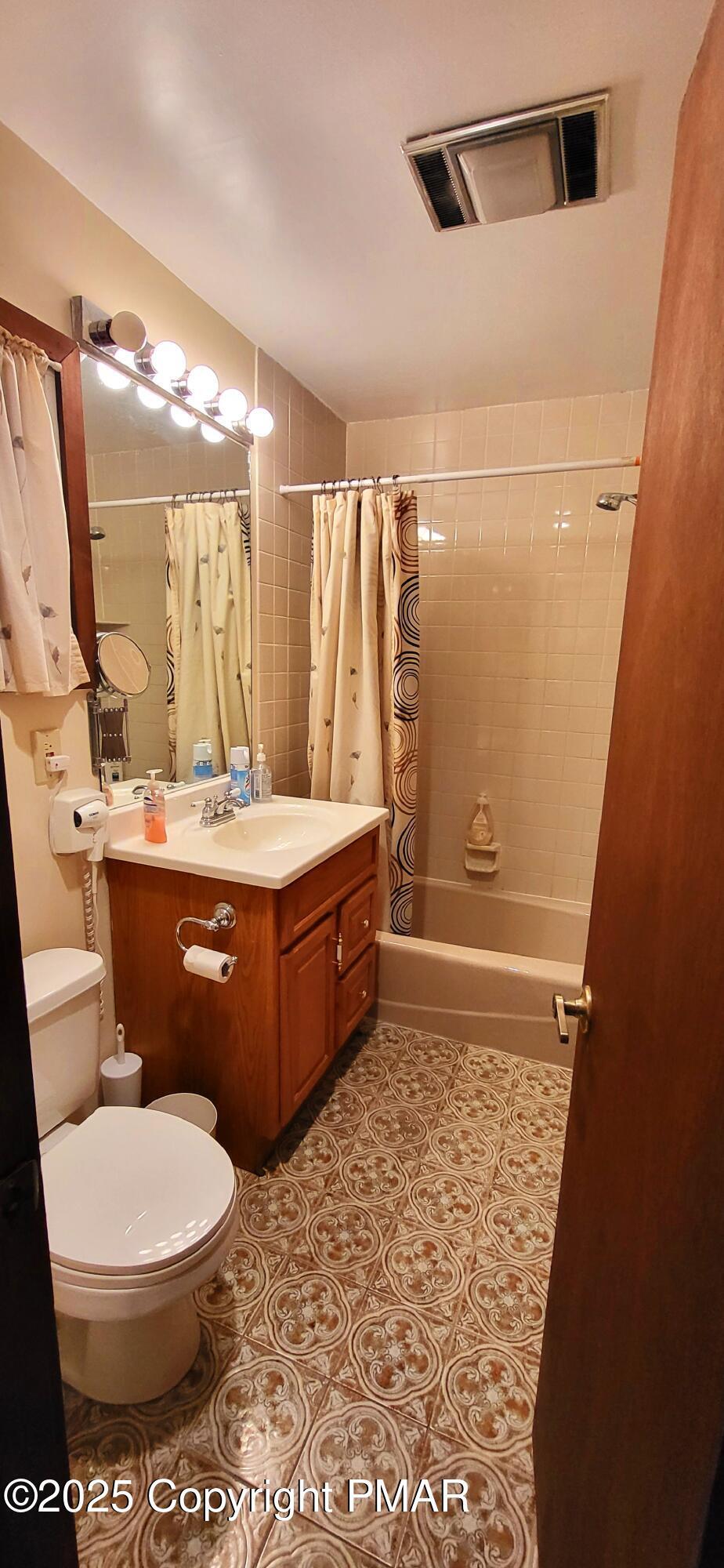 6298 Decker Road Bushkill, PA 18324 - Photo 21 of 65 a bathroom with a sink a toilet and shower