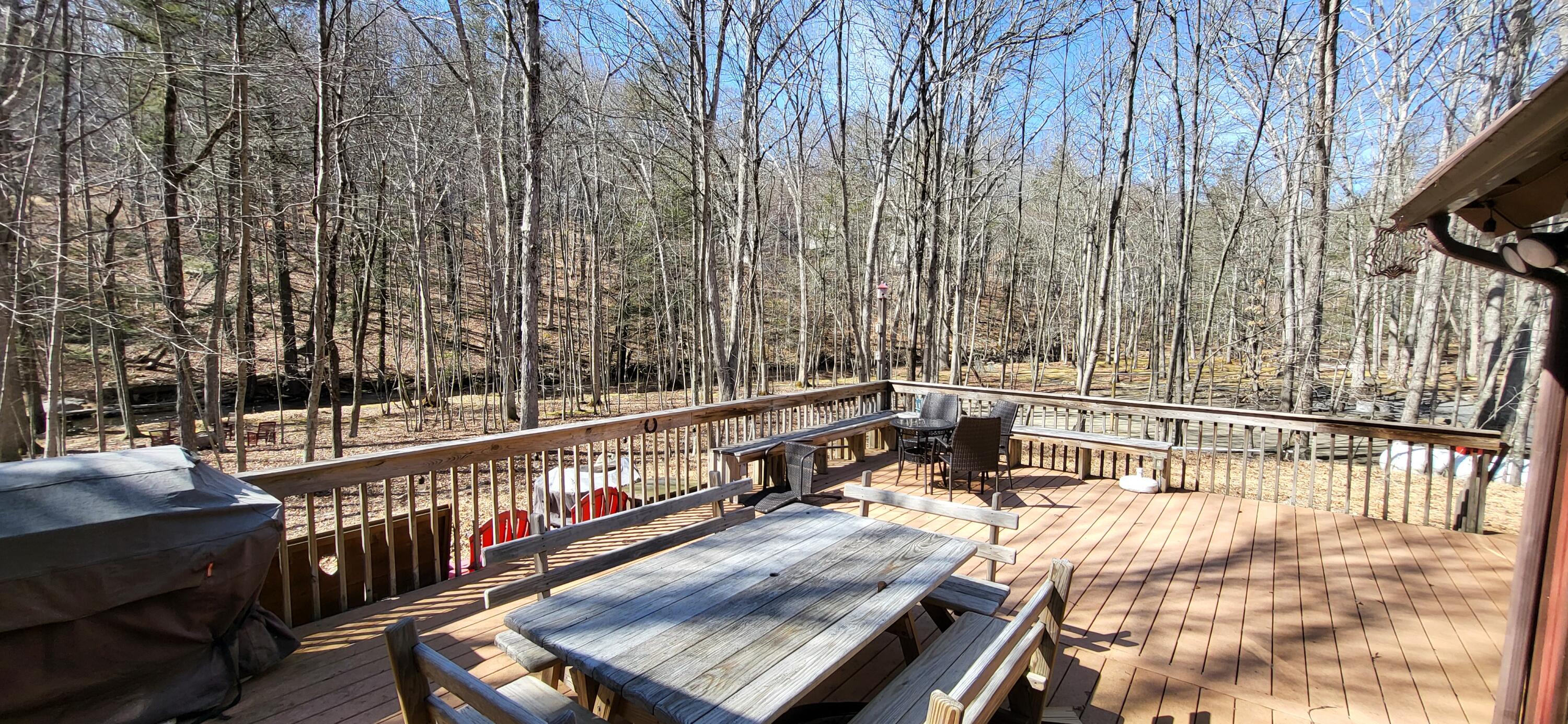 6298 Decker Road Bushkill, PA 18324 - Photo 40 of 65 a view of balcony with wooden floor and outdoor seating