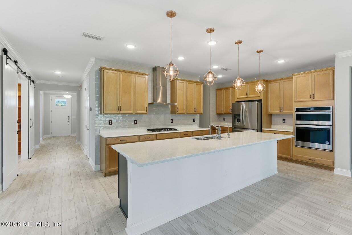106 Key Grass Court St. Johns, FL 32259 - Photo 11 of 80 a large kitchen with kitchen island a sink stainless steel appliances and cabinets