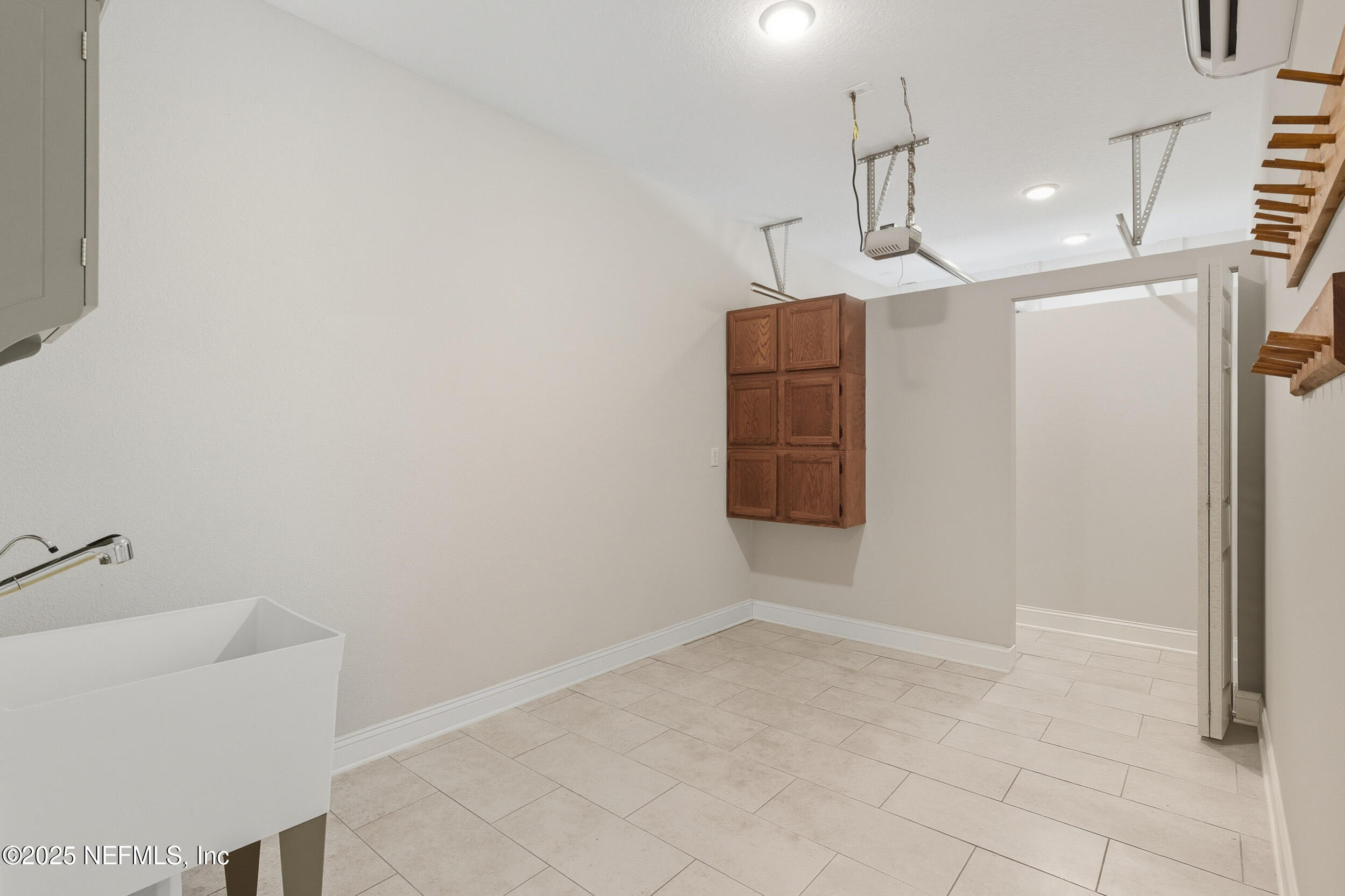 106 Key Grass Court St. Johns, FL 32259 - Photo 37 of 80 a view of a storage & utility room with racks on the wall