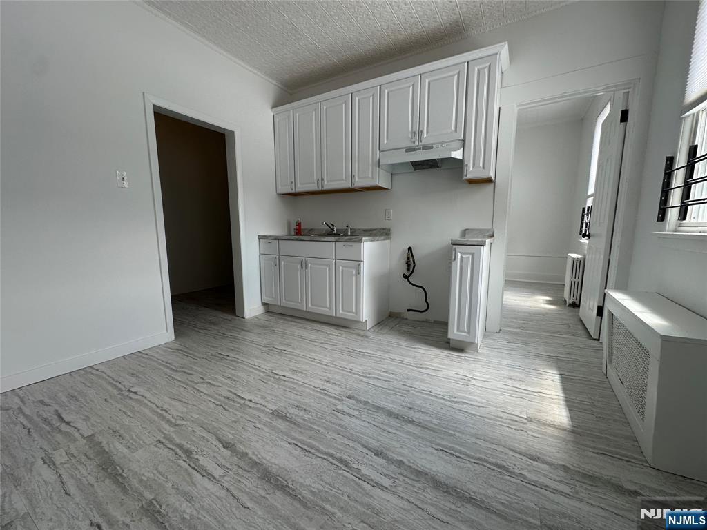 526 Valley Brook Avenue, Unit 2 Lyndhurst, NJ 07071 - Photo 2 of 13 a kitchen with stainless steel appliances a refrigerator sink and cabinets