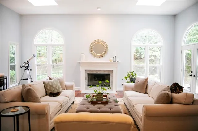 a living room with furniture and a vase