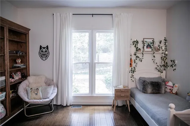 a bedroom with a bed and a table