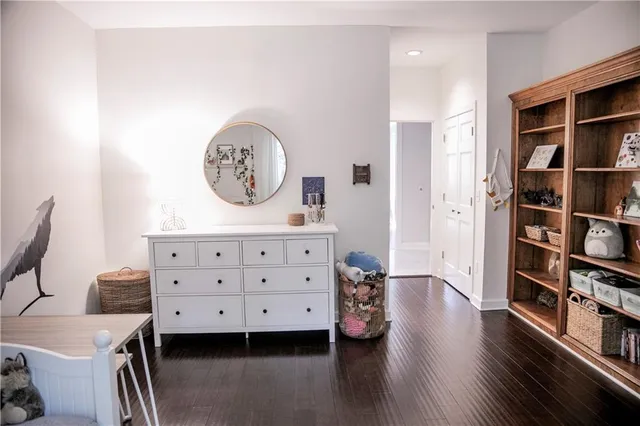 a bathroom with a toilet a sink and a mirror