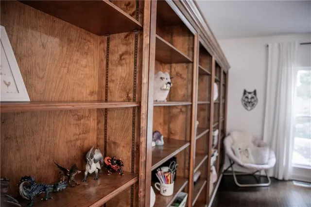 a living room with a bed furniture and a window