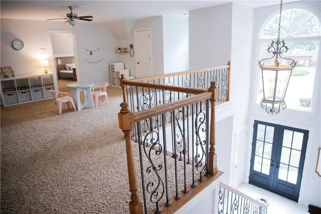 a bathroom with a granite countertop toilet a sink and a mirror