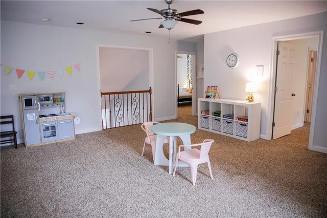 a work room with furniture and a window