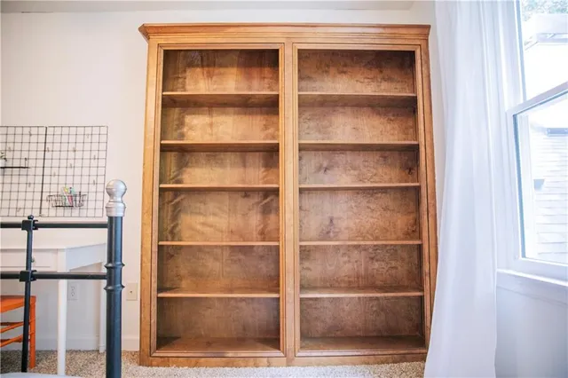 a view of a patio with a table and chairs under an umbrella