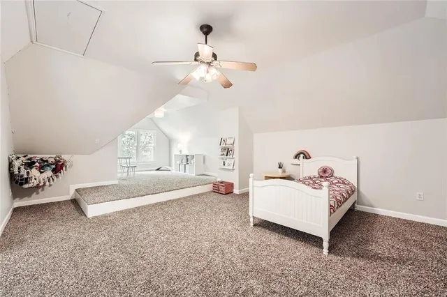 a view of backyard with swimming pool and sitting area