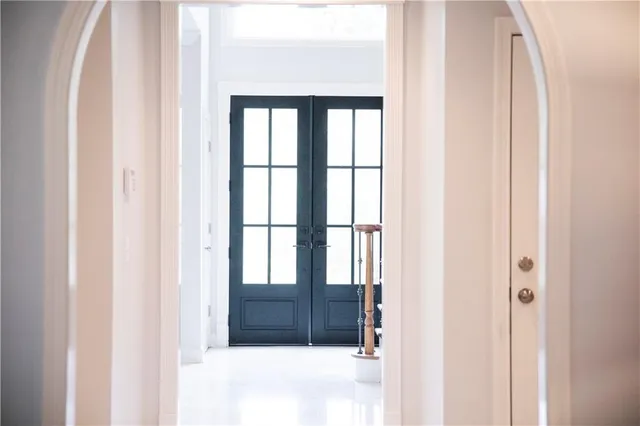 a view of staircase with white walls and a window