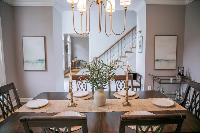 a living room with furniture a window and a table