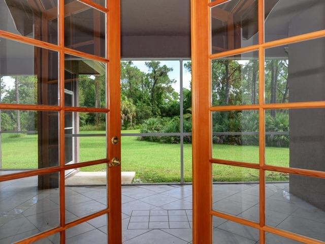 12557 154th Road North Jupiter, FL 33478 - Photo 6 of 38 a view of a garden from a window