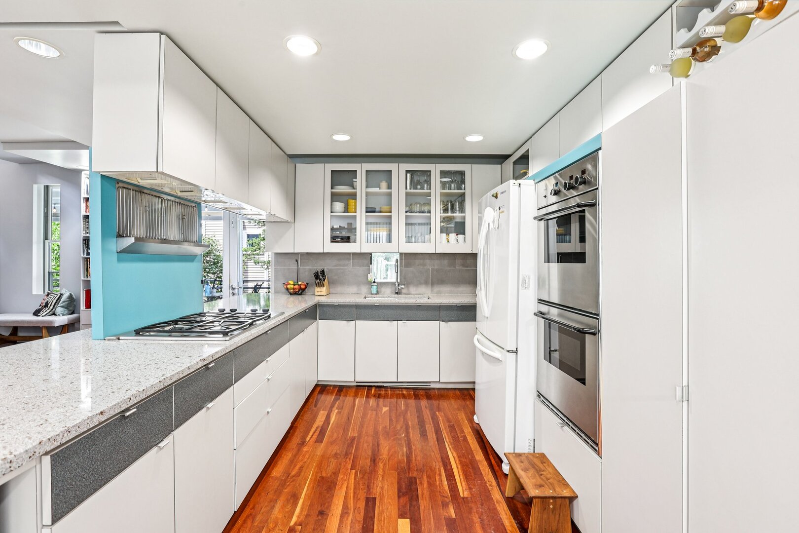 1003 Wesley Avenue Evanston, IL 60202 - Photo 15 of 35 a large kitchen with a sink and dishwasher stove a refrigerator a sink with wooden floor