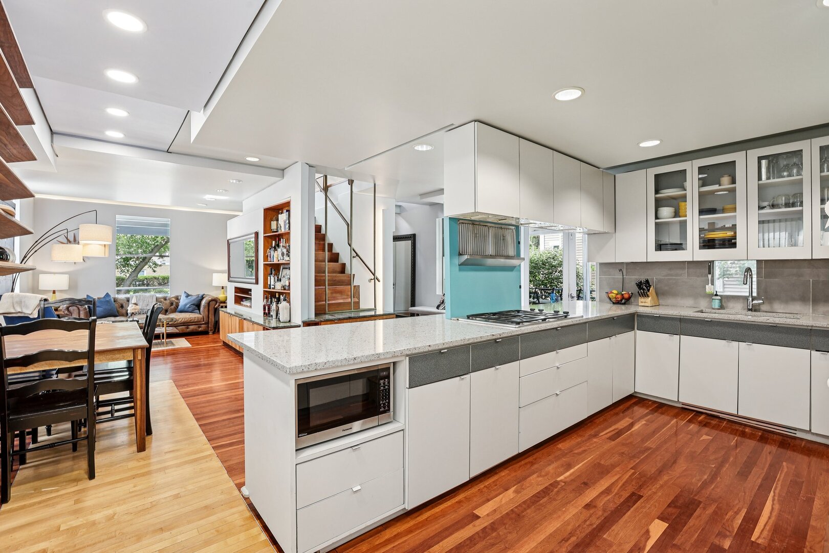 1003 Wesley Avenue Evanston, IL 60202 - Photo 16 of 35 a kitchen with stainless steel appliances granite countertop a stove and a wooden floors