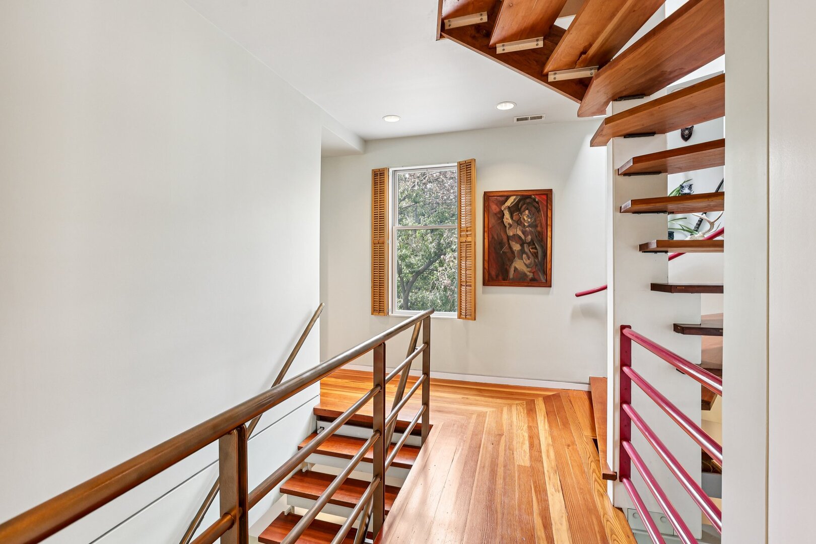 1003 Wesley Avenue Evanston, IL 60202 - Photo 18 of 35 a view of a hallway with wooden floor and staircase