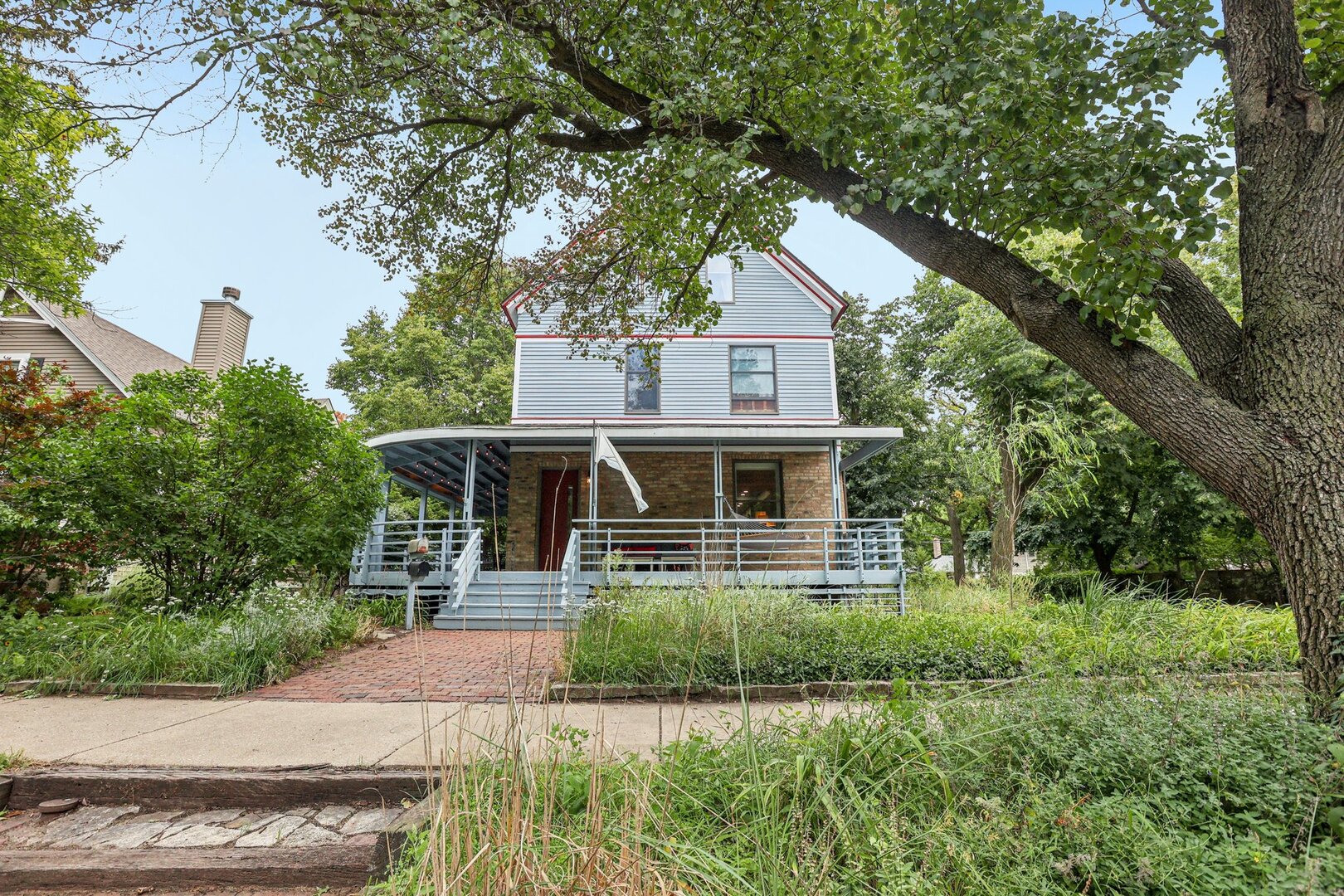 1003 Wesley Avenue Evanston, IL 60202 - Photo 2 of 35 a front view of a house with a yard and potted plants