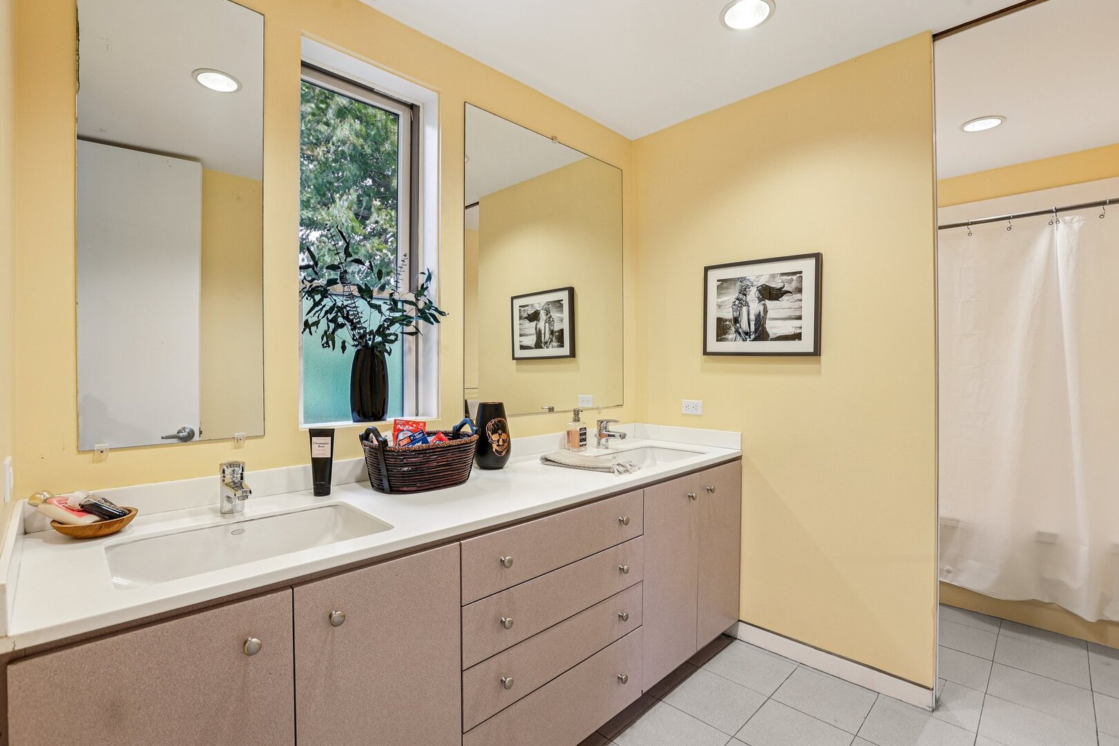 1003 Wesley Avenue Evanston, IL 60202 - Photo 22 of 35 a bathroom with a double vanity sink and a mirror