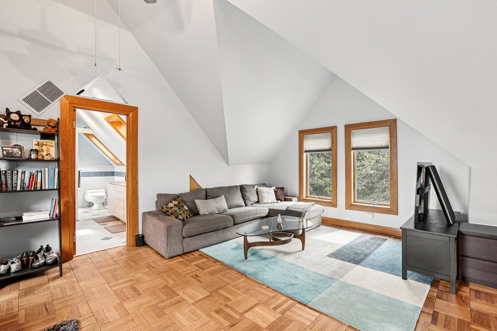 1003 Wesley Avenue Evanston, IL 60202 - Photo 27 of 35 a living room with furniture hard wood floor and a floor to ceiling window