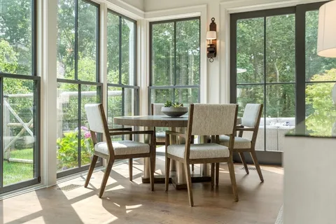 a dining room with furniture and window