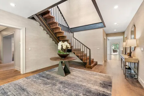 a view of an entryway with wooden floor