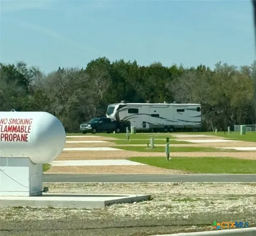 a view of living room with furniture and a rug