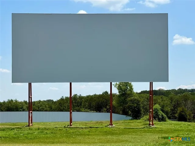a view of a chairs in backyard