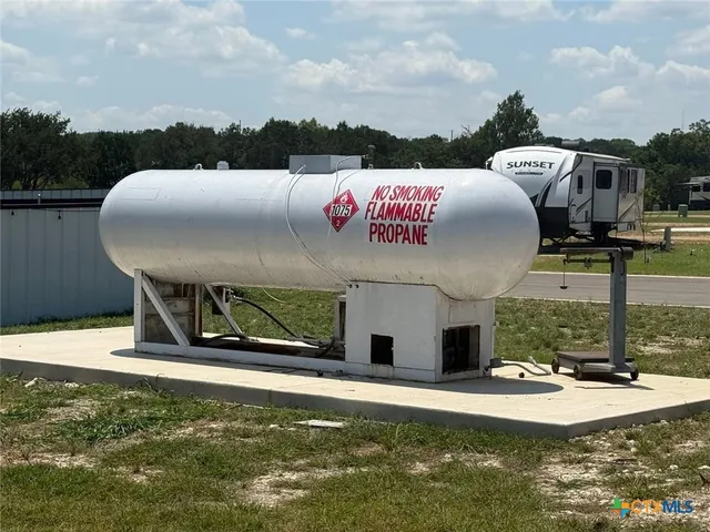 a view of a chairs and table in the ocean