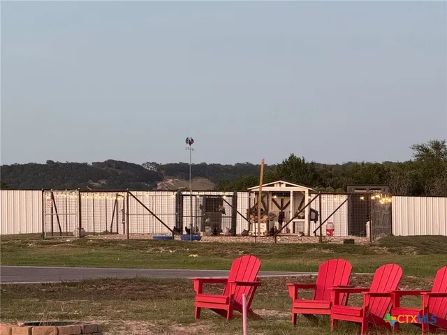 an aerial view of a residential houses with outdoor space