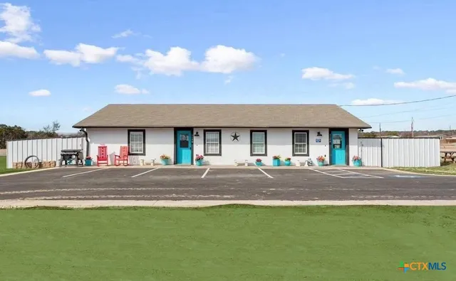 a view of a chairs and table in the ocean