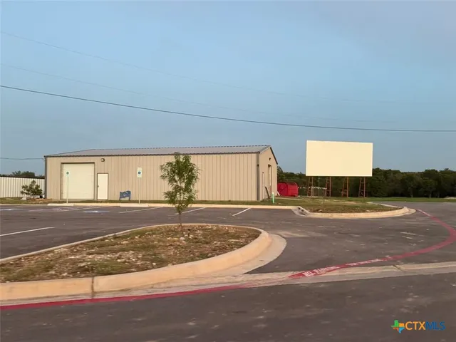 a view of yard with swimming pool