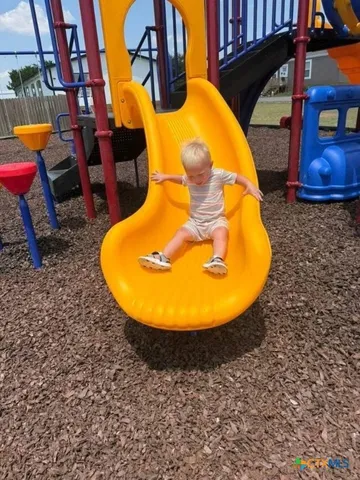 a view of a park with slide