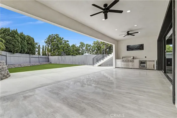 a front view of a house with a garden and yard