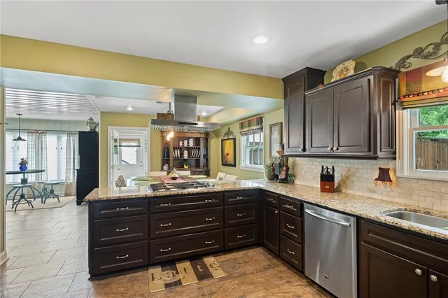 a kitchen with a sink and wooden cabinets