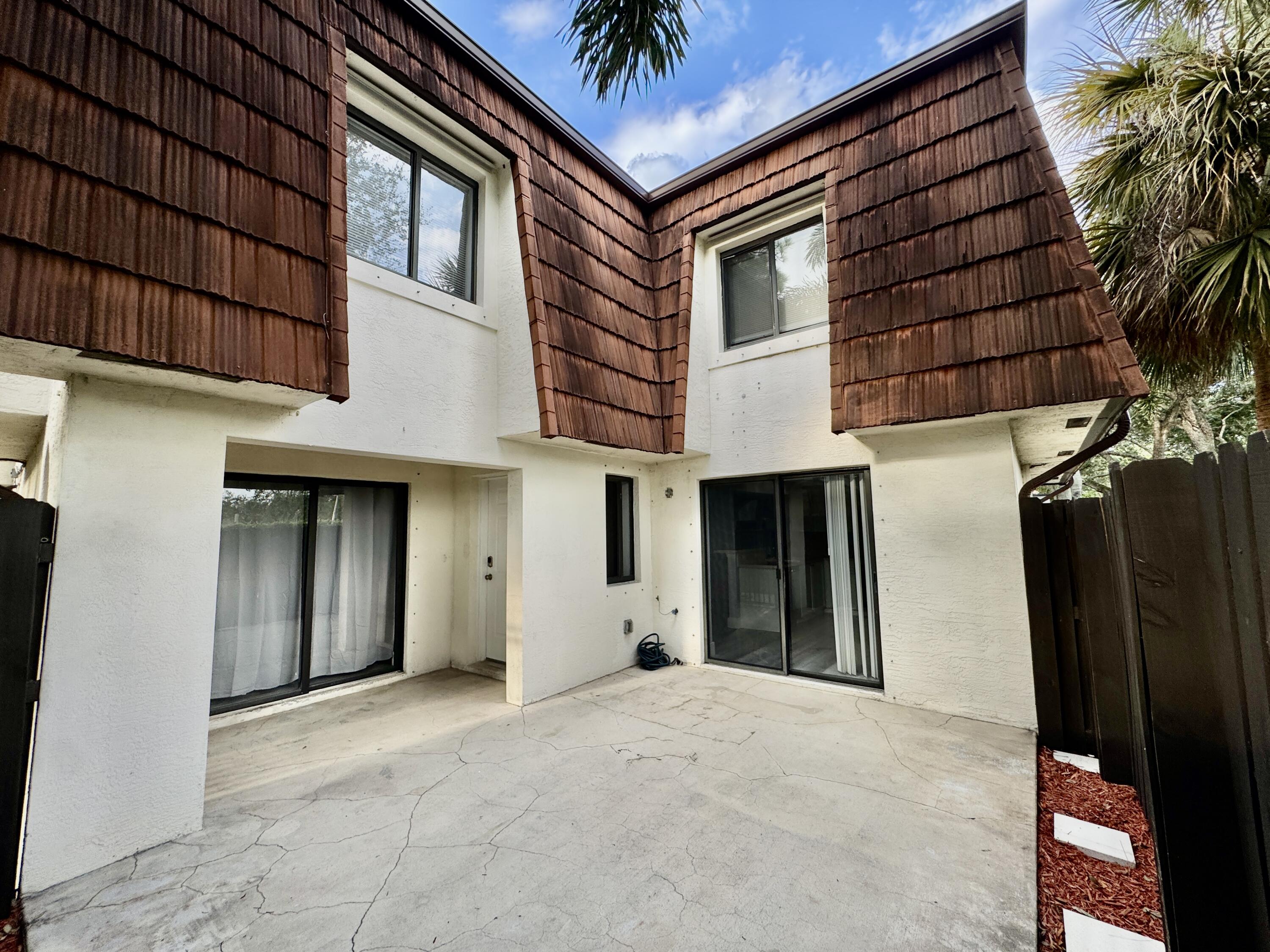 2216 White Pine Circle, Unit D Greenacres, FL 33415 - Photo 3 of 29 Courtyard