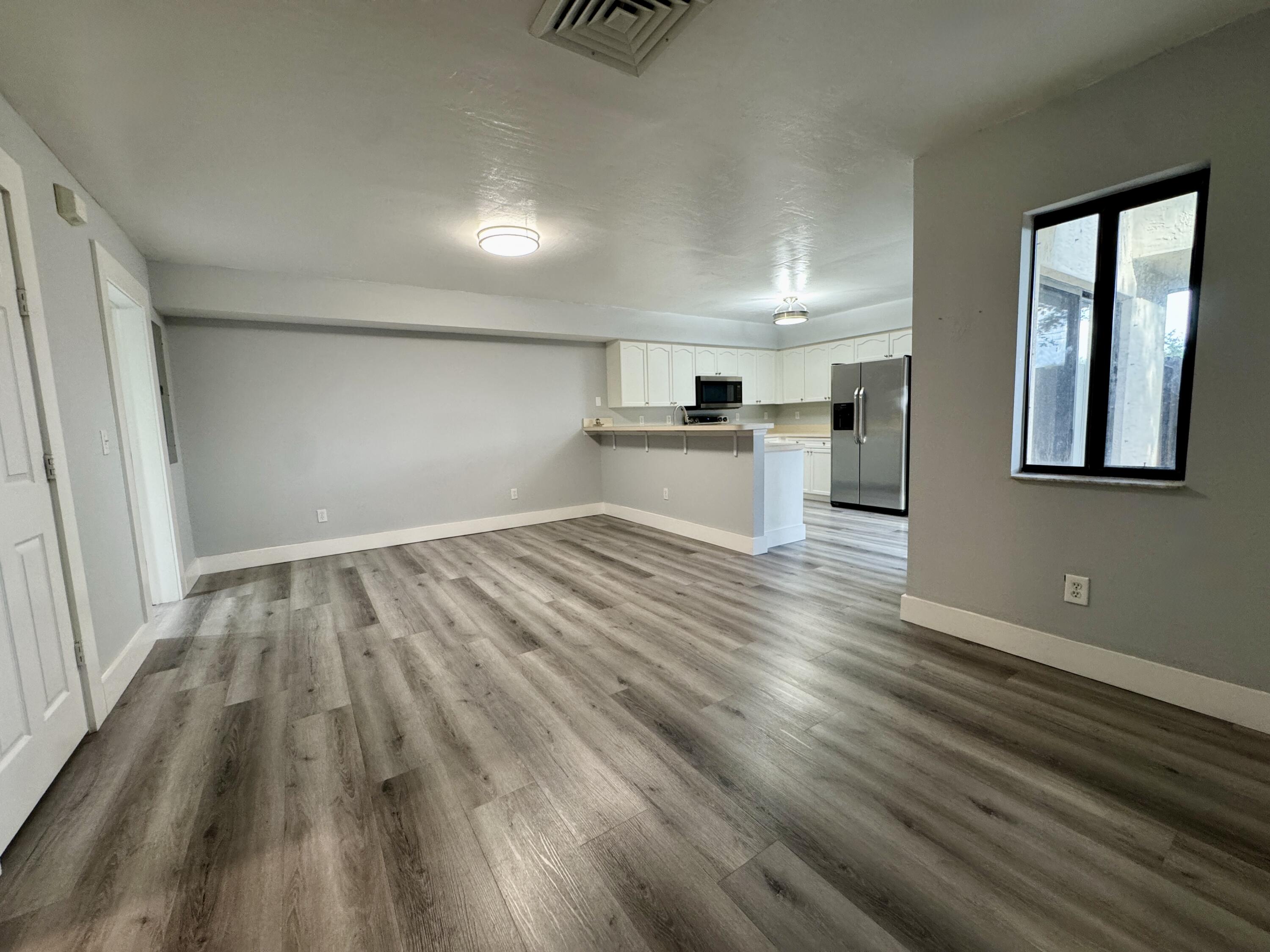 2216 White Pine Circle, Unit D Greenacres, FL 33415 - Photo 6 of 29 Livingroom to Dining Room View