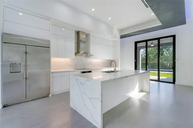 a bathroom with a toilet a sink a mirror and a window