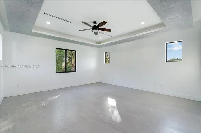 a view of house with a swimming pool and outdoor seating