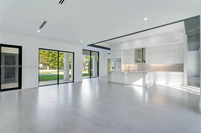 a view of house with a swimming pool and outdoor seating