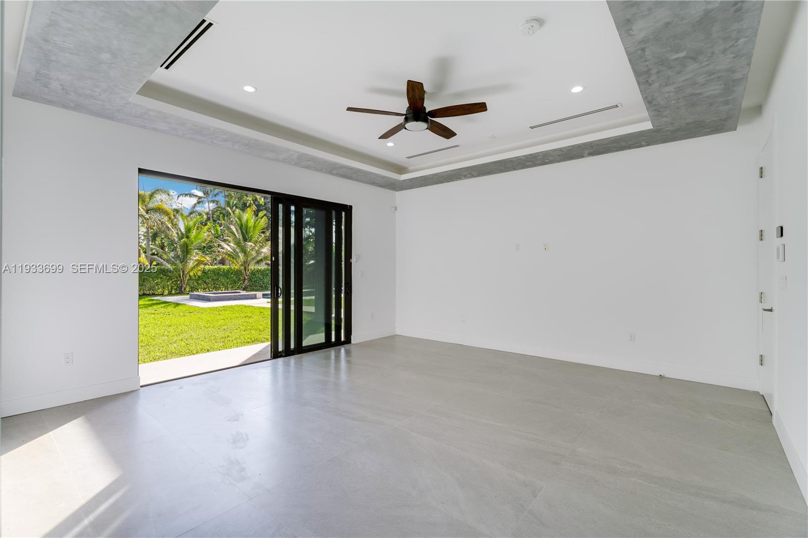 10398 Southwest 64th Street Miami, FL 33173 - Photo 36 of 88 wooden floor in an empty room with a window