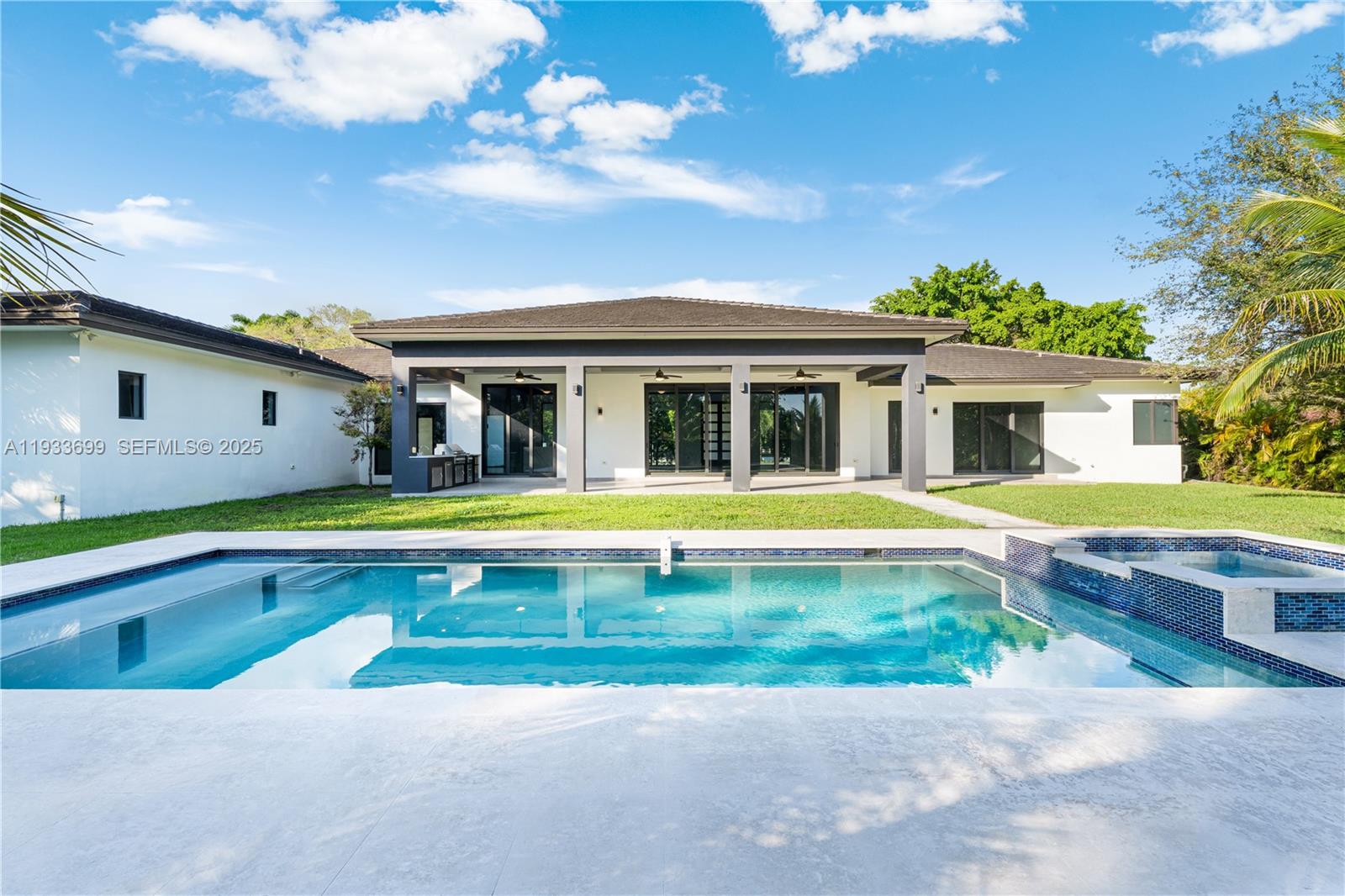 10398 Southwest 64th Street Miami, FL 33173 - Photo 55 of 88 a view of house with a swimming pool and outdoor seating