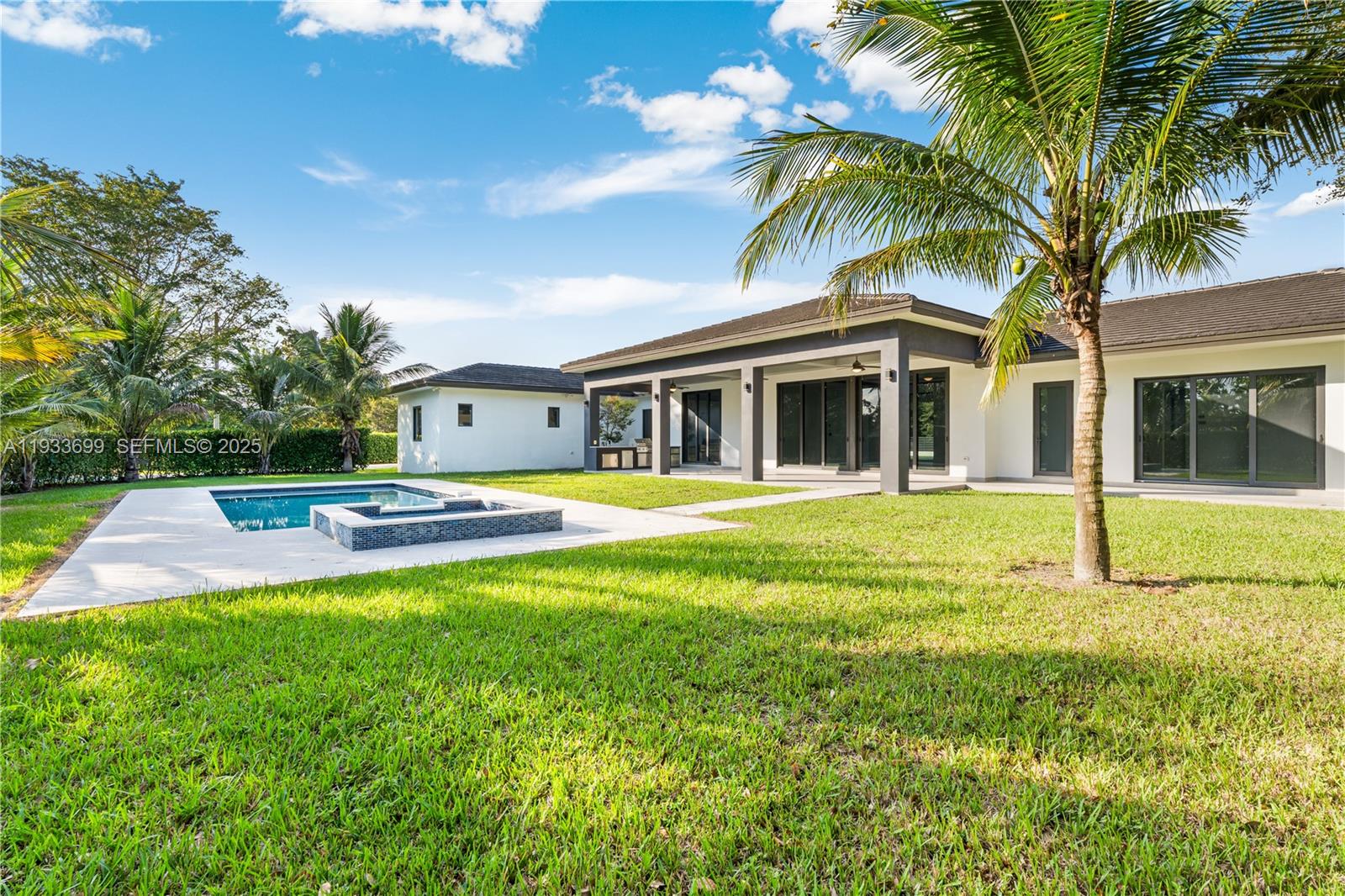 10398 Southwest 64th Street Miami, FL 33173 - Photo 56 of 88 a view of a house with a swimming pool