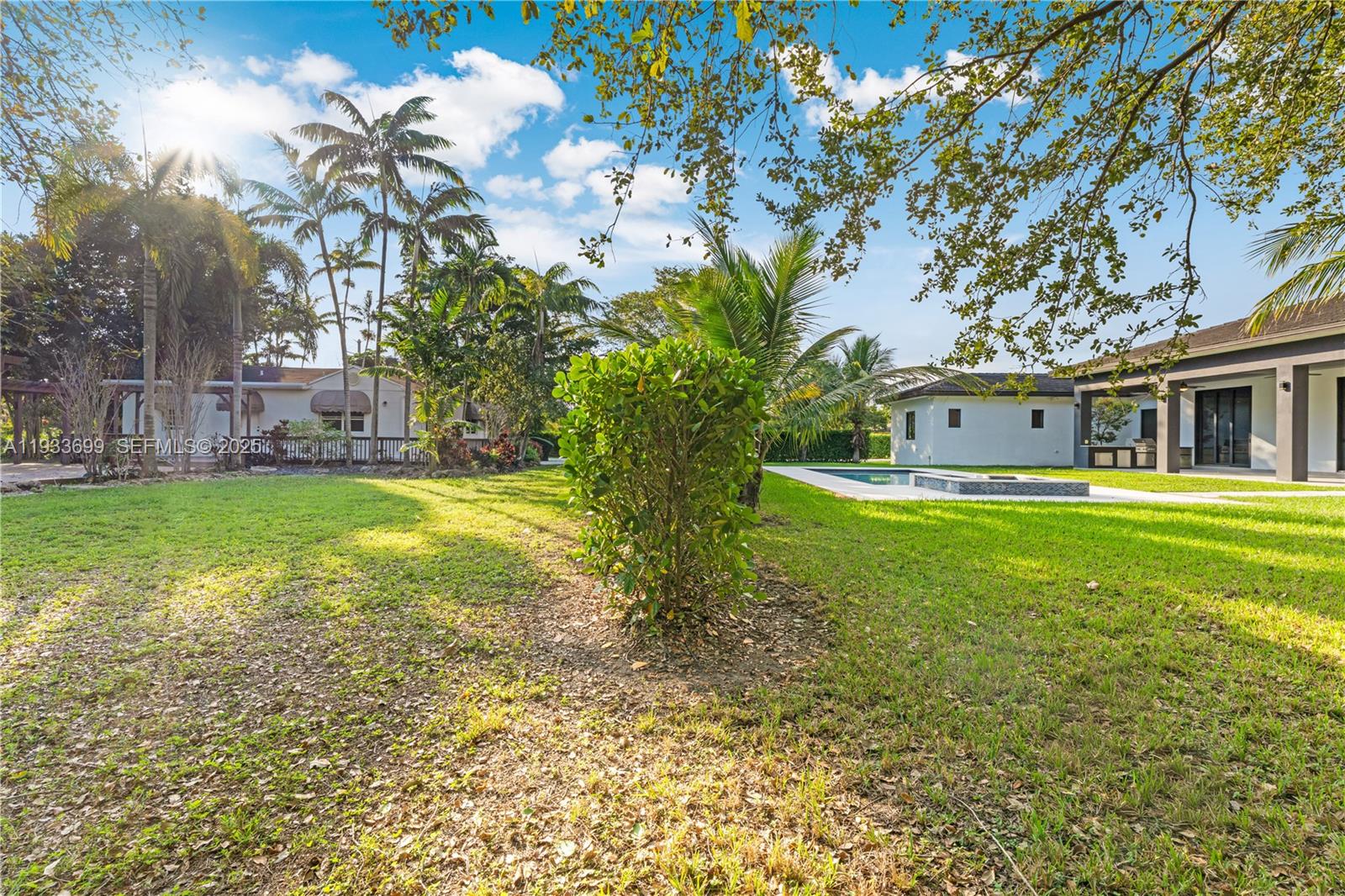 10398 Southwest 64th Street Miami, FL 33173 - Photo 60 of 88 a house view with swimming pool in front of it