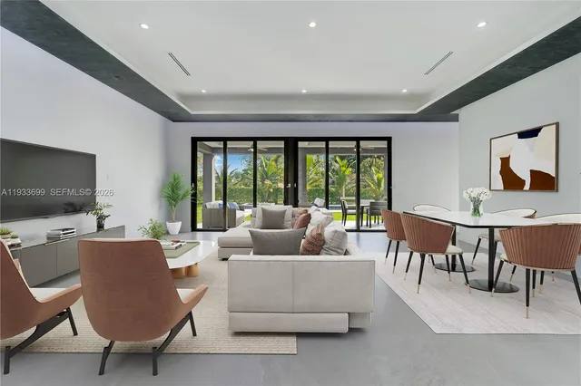 a room with pool table and windows