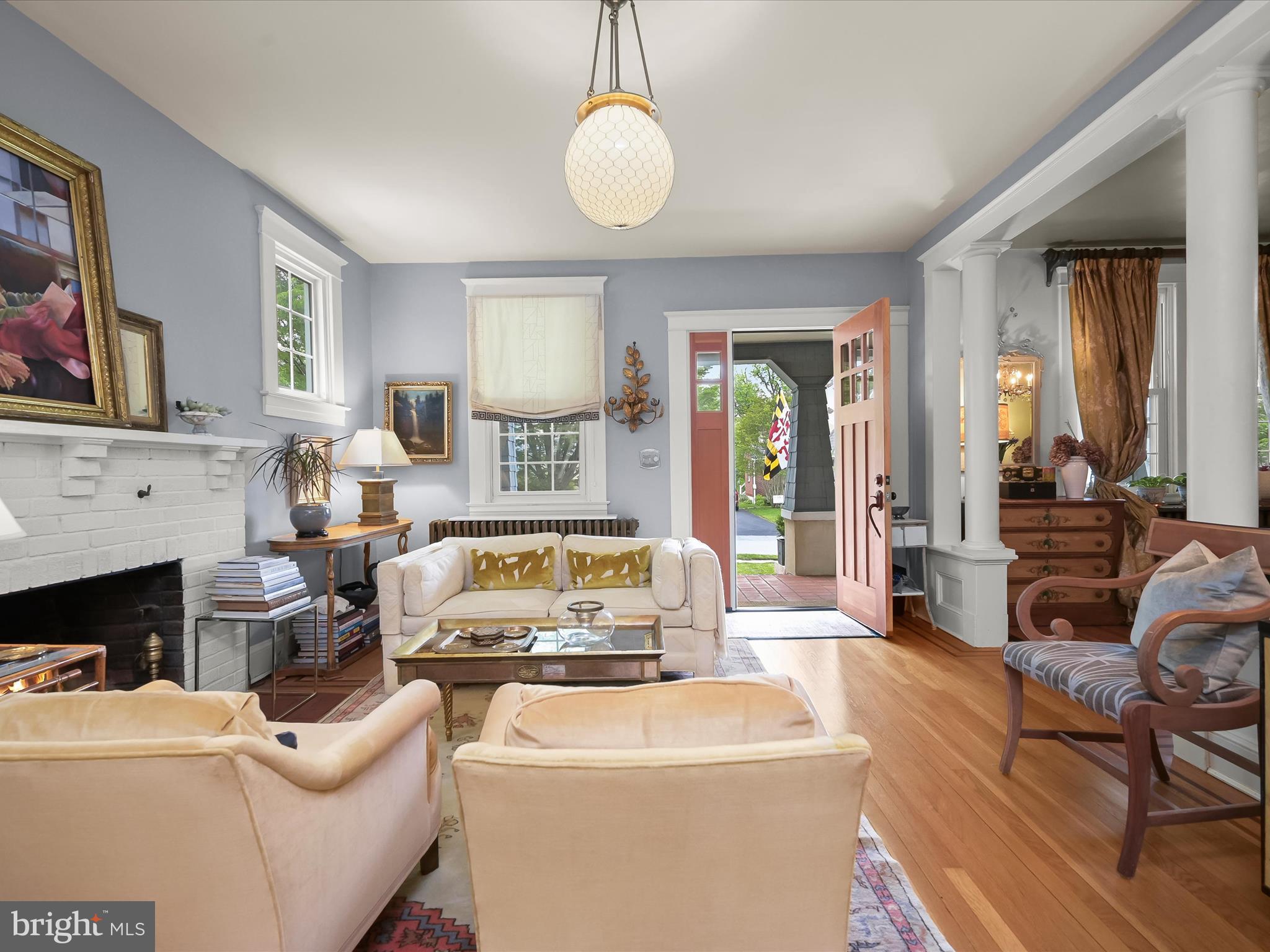 112 Park Drive Baltimore, MD 21228 - Photo 2 of 86 a living room with furniture a fireplace and a flat screen tv
