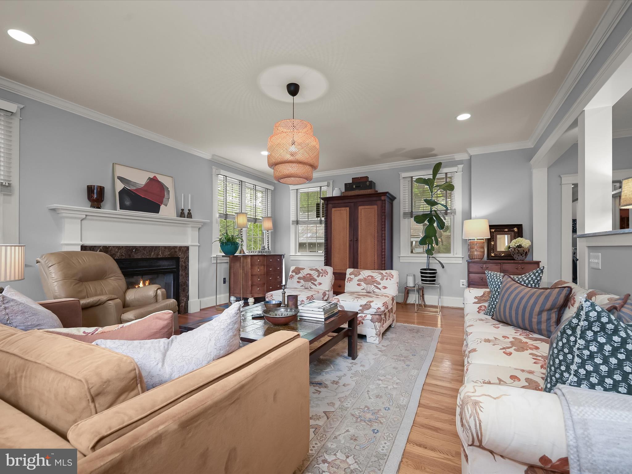 112 Park Drive Baltimore, MD 21228 - Photo 29 of 86 a living room with furniture and a fireplace