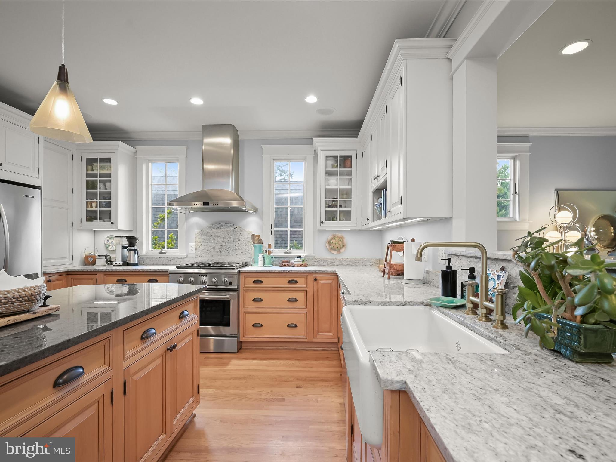 112 Park Drive Baltimore, MD 21228 - Photo 3 of 86 a large kitchen with stainless steel appliances granite countertop a stove a sink dishwasher and cabinets with wooden floor