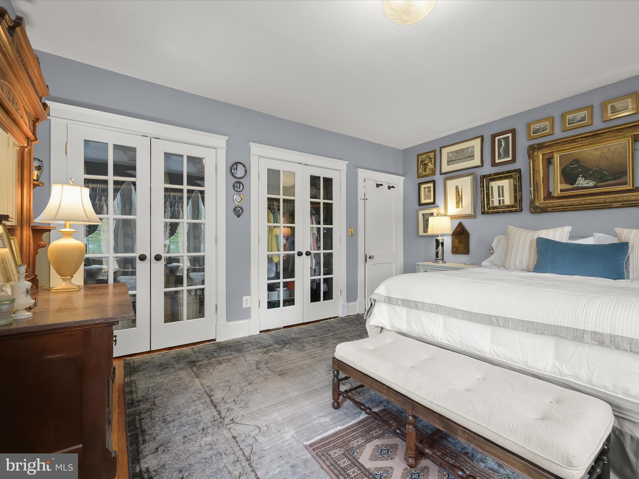 112 Park Drive Baltimore, MD 21228 - Photo 34 of 86 a spacious bedroom with a bed and glass windows