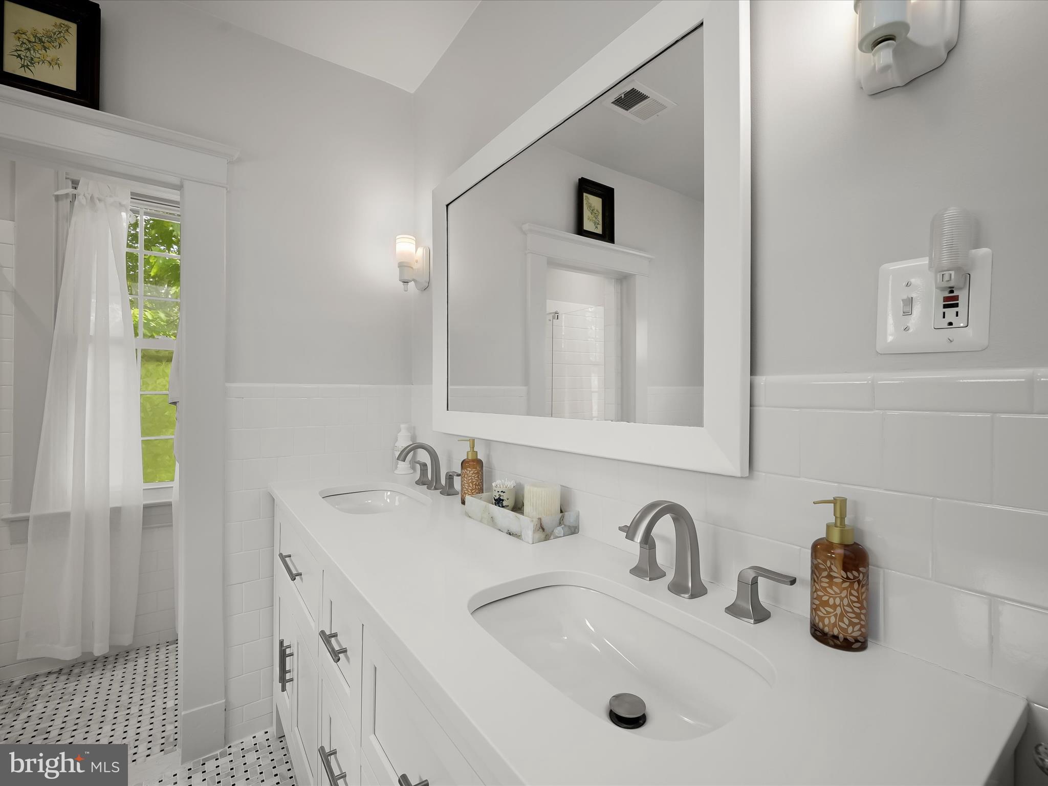 112 Park Drive Baltimore, MD 21228 - Photo 36 of 86 a bathroom with a sink and a mirror