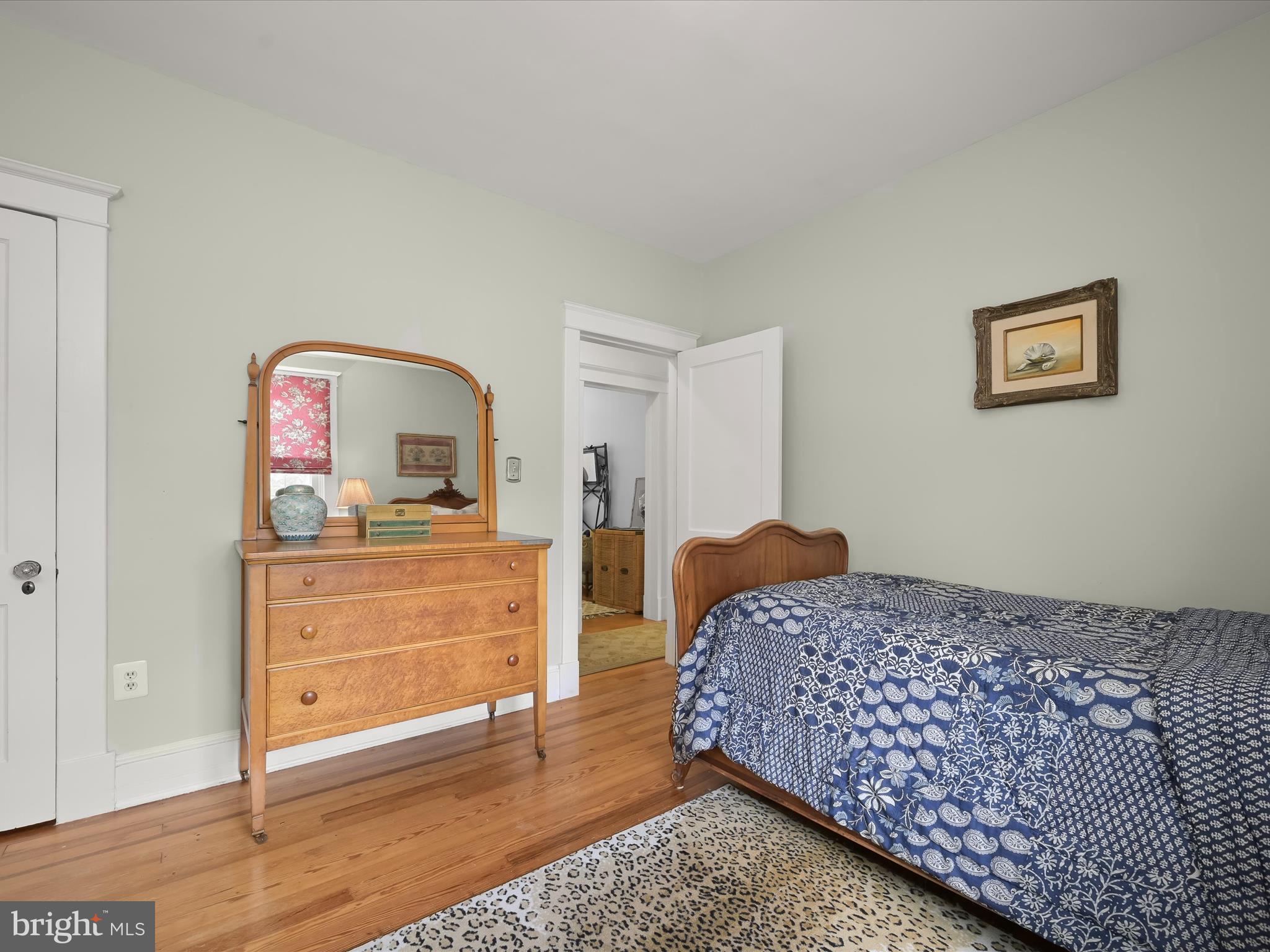 112 Park Drive Baltimore, MD 21228 - Photo 41 of 86 a bedroom with a bed and a dresser